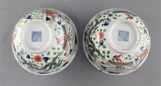 A pair of Chinese wucai dragon and phoenix bowls, Qianlong mark and of the period (1736-95), diameter 15.6cm, some damage